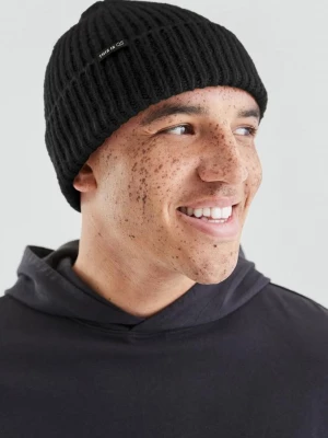 Foto van product Gebreide muts in grove breistructuur met logo QS zwart
