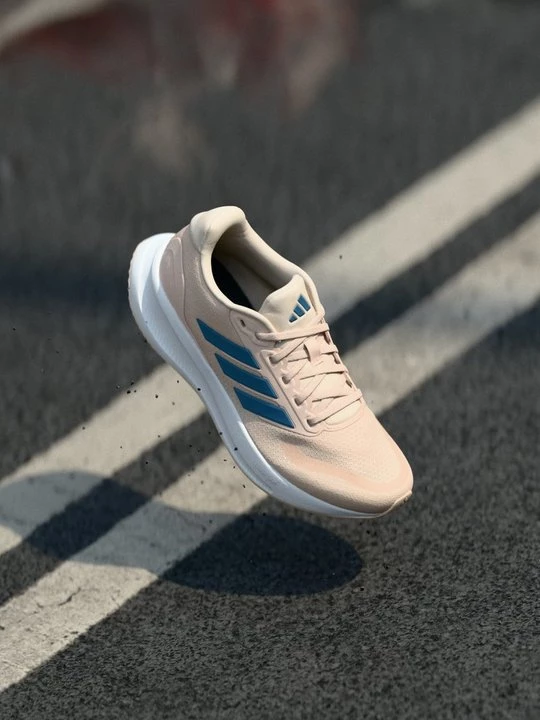 Foto van product Hardloopschoenen voor op de weg Adidas donkerroze