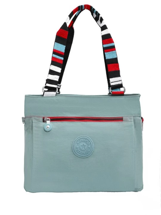 Foto van product Mindesa Schoudertas lichtblauw / rood / zwart / wit