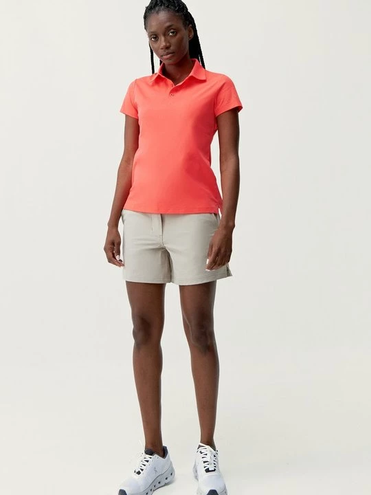 Foto van product Poloshirt Born Living Yoga koraalrood