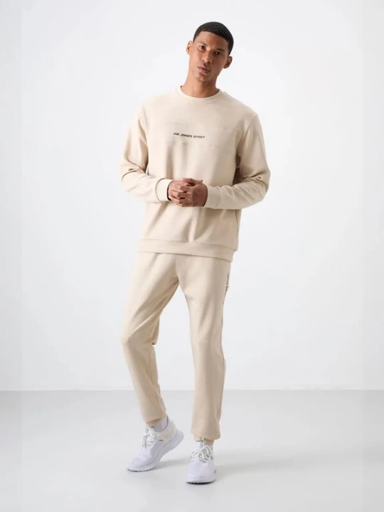 Foto van product Tommy Life Joggingpak beige