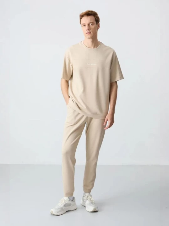 Foto van product Tommy Life Joggingpak beige