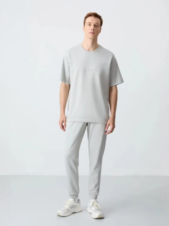 Foto van product Tommy Life Joggingpak lichtgrijs