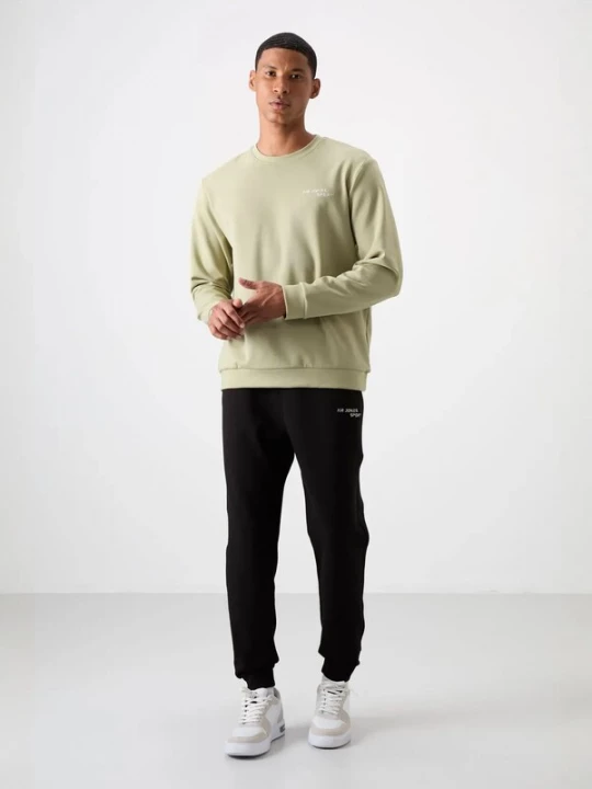Foto van product Tommy Life Joggingpak pastelgroen / zwart
