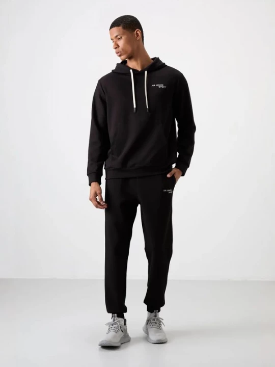 Foto van product Tommy Life Joggingpak zwart / wit