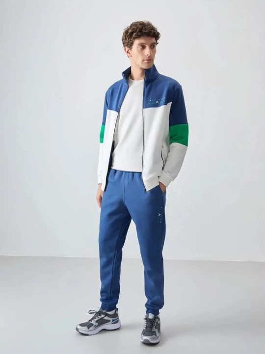 Foto van product Tommy Life Trainingspak blauw / groen / wit