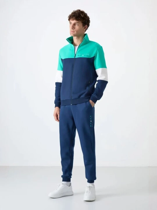 Foto van product Tommy Life Trainingspak navy / mintgroen / wit