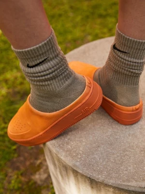 Foto van product Muiltjes Nike oranje