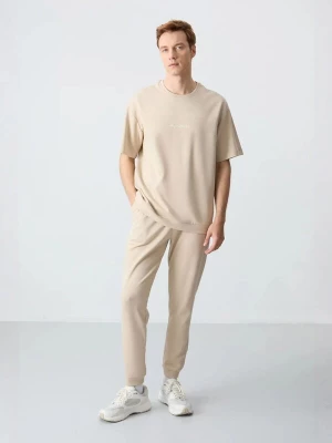 Foto van product Tommy Life Joggingpak beige