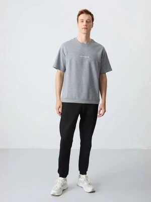Foto van product Tommy Life Joggingpak grijs / zwart