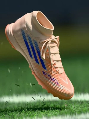 Foto van product Voetbalschoenen voor kunstgras Adidas oranje